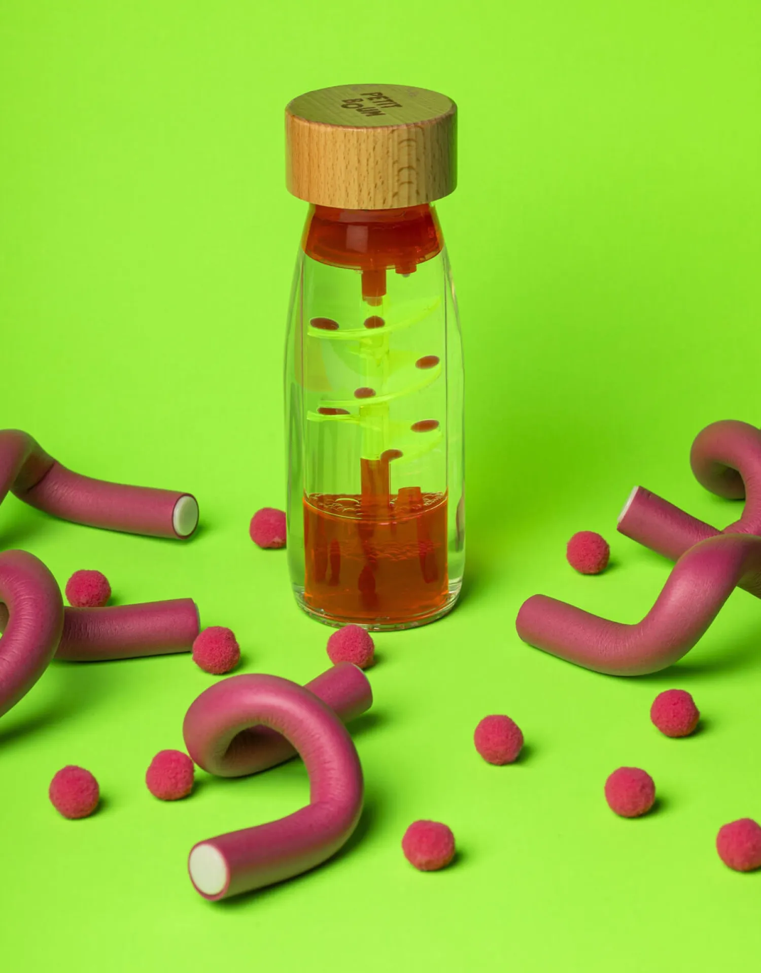 Idealne W Podróży|12M+ | Petit Boum Butelka sensoryczna dwufazowa MOVE SPIRALA różowa